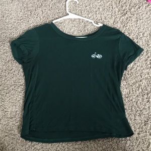 Green shirt with an embroided bicycle
